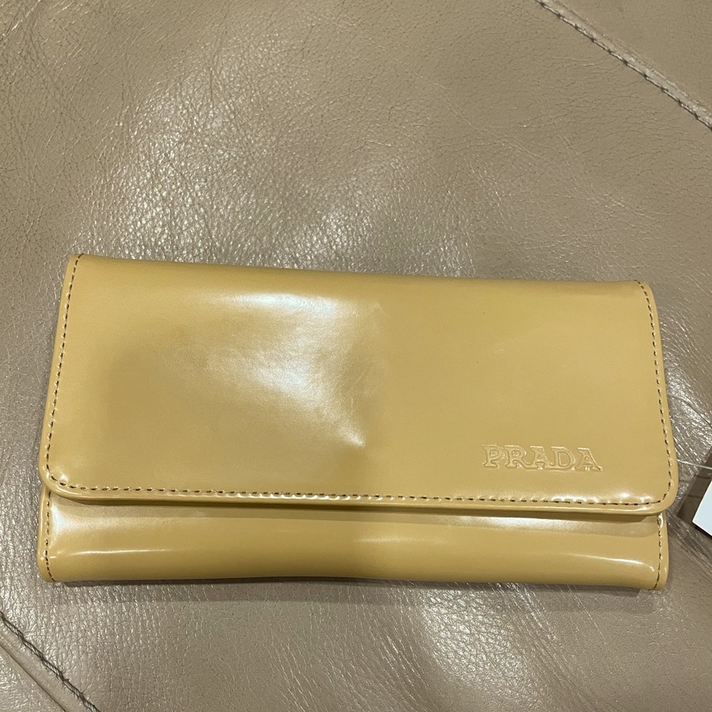 New Prada Wallet the color is Camel Tan. Very nice wallet